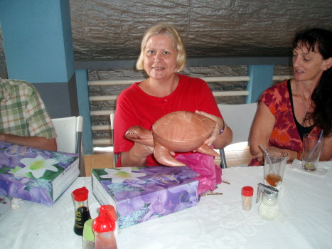 Catherine Good receives a turtle at her luncheon