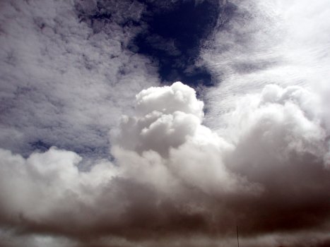 Cumulus under altocumulus clouds