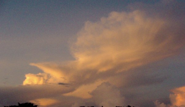 Cumulonimbus at sunset can display a spectacular array of colors ranging from reds to oranges and yellows.